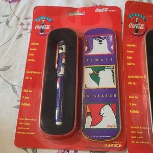 Vintage Coca-Cola Collectible Ceramic Roller Ball Pen and Santa Tin NIP 1996.